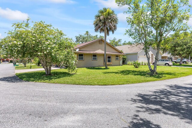 104 Herring Gull Ct, Daytona Beach, FL 32119 - view of front of house featuring a front yard and driveway