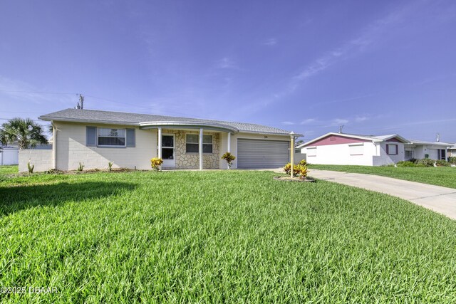 34 Kathy Dr, Ormond Beach, FL 32176 - ranch-style house with concrete driveway, an attached garage, and a front yard