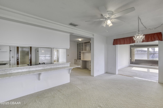34 Kathy Dr, Ormond Beach, FL 32176 - unfurnished living room with a ceiling fan, light carpet, and a chandelier