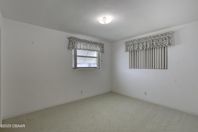 34 Kathy Dr, Ormond Beach, FL 32176 - spare room featuring carpet floors and a textured ceiling