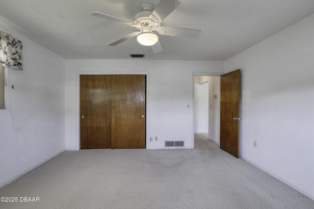 34 Kathy Dr, Ormond Beach, FL 32176 - unfurnished bedroom featuring carpet flooring, a closet, ceiling fan, and baseboards