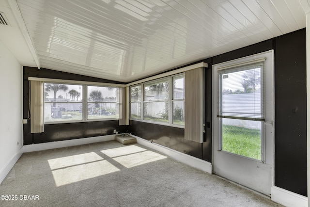 34 Kathy Dr, Ormond Beach, FL 32176 - unfurnished sunroom featuring healthy amount of natural light, carpet, lofted ceiling, and baseboards