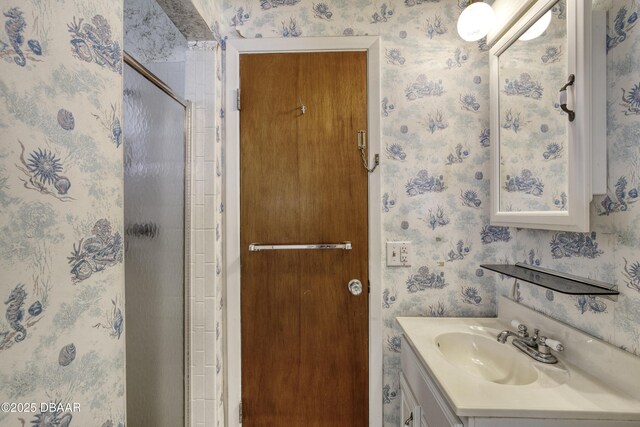 34 Kathy Dr, Ormond Beach, FL 32176 - bathroom featuring wallpapered walls, vanity, and a stall shower