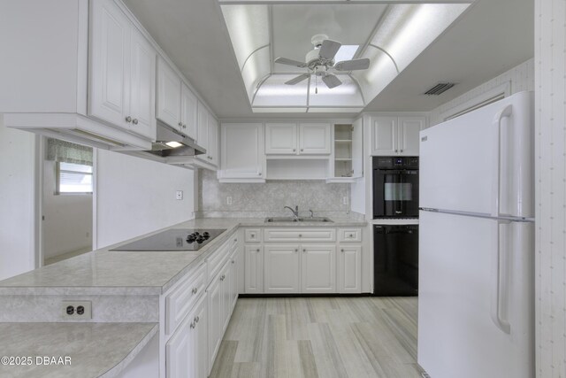 34 Kathy Dr, Ormond Beach, FL 32176 - kitchen featuring black appliances, open shelves, a sink, light countertops, and a ceiling fan
