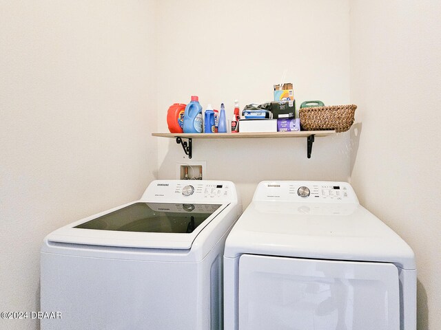 laundry area with separate washer and dryer