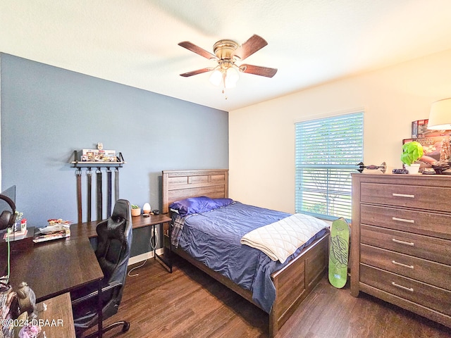 bedroom featuring ceiling fan and dark hardwood / wood-style floors