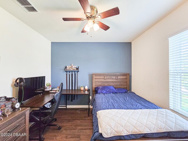 bedroom featuring dark wood-type flooring and ceiling fan