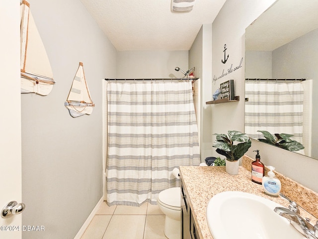 bathroom with toilet, tile patterned floors, a textured ceiling, vanity, and a shower with shower curtain