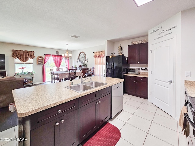 kitchen with sink, black refrigerator with ice dispenser, decorative light fixtures, an island with sink, and dishwasher