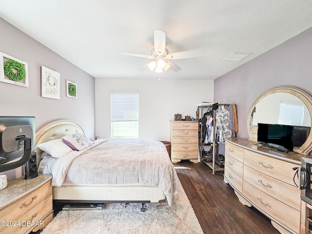 bedroom featuring dark hardwood / wood-style flooring and ceiling fan