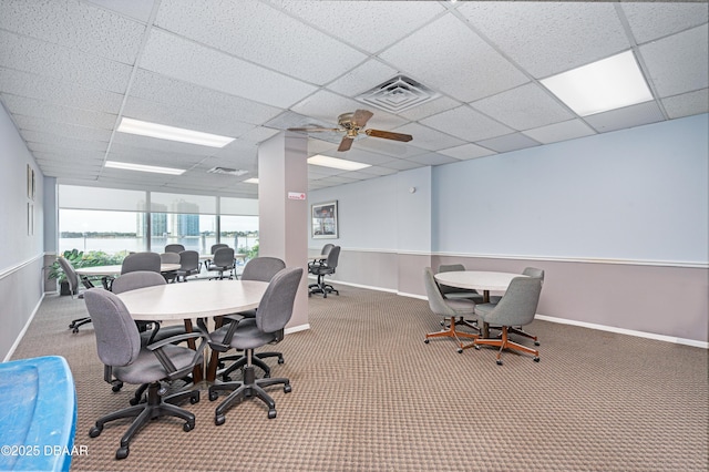 home office featuring a paneled ceiling, carpet floors, and ceiling fan