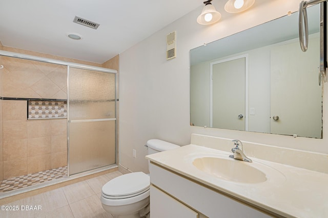 bathroom featuring walk in shower, tile patterned floors, vanity, and toilet