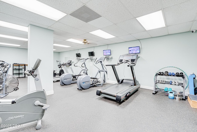 workout area with a paneled ceiling