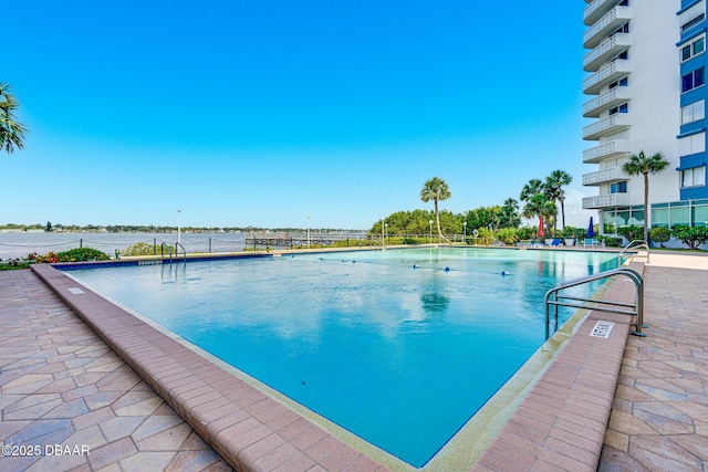 view of swimming pool with a patio area