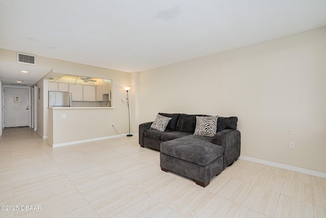 living room with light tile patterned floors