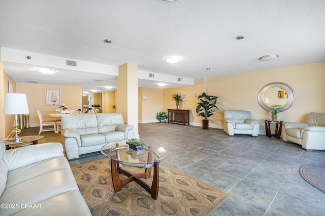 living room featuring a textured ceiling