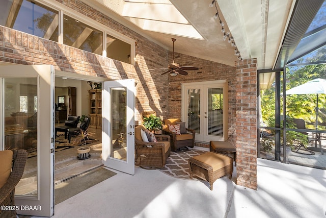 view of patio with french doors, ceiling fan, a lanai, and an outdoor hangout area