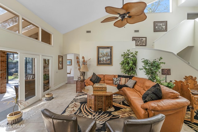 living area featuring high vaulted ceiling, visible vents, arched walkways, and ceiling fan