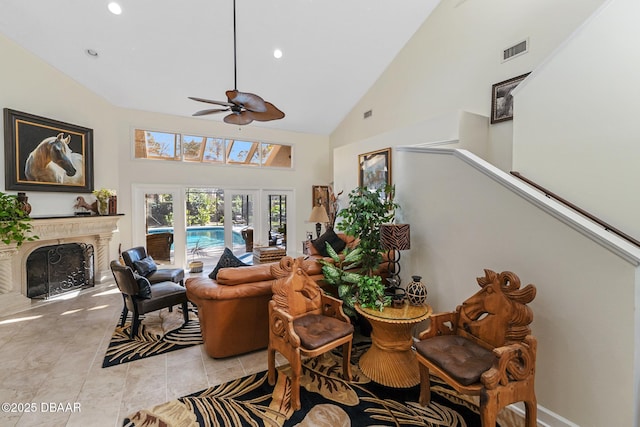 living room featuring visible vents, ceiling fan, a fireplace, high vaulted ceiling, and recessed lighting