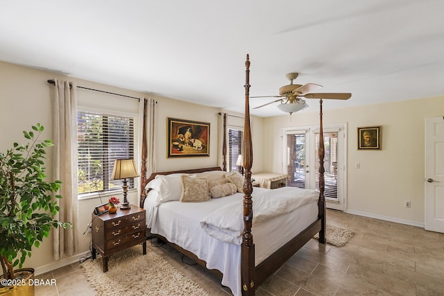 bedroom with access to exterior, multiple windows, baseboards, and a ceiling fan