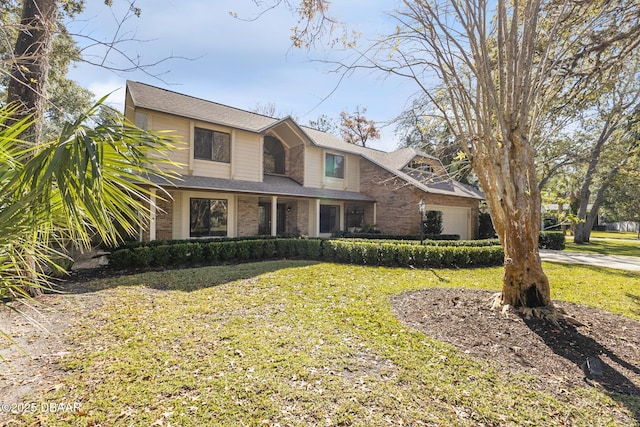 view of front of home with brick siding and a front yard