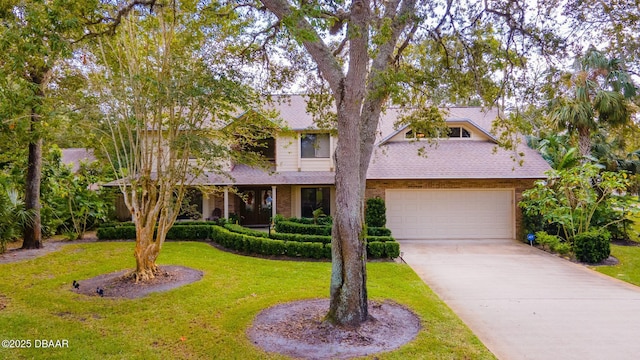 view of front facade with a garage and a front lawn