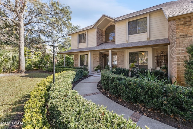 view of front of home featuring a front lawn