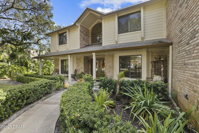 view of front of home with a garage and a front lawn