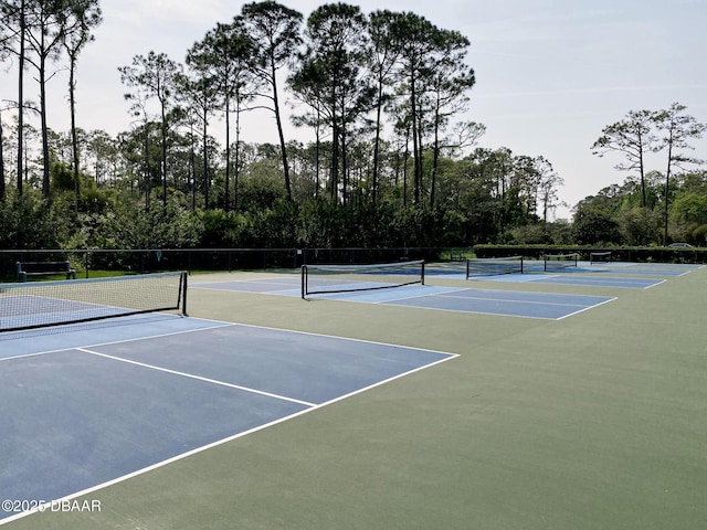 view of tennis court with fence