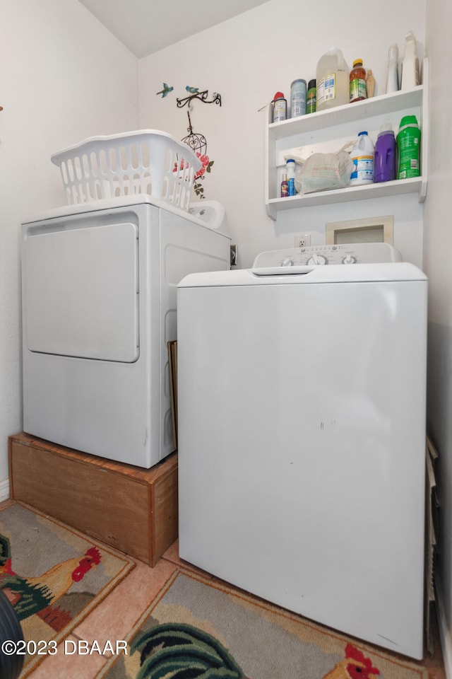 laundry area with independent washer and dryer