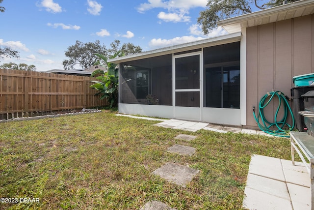 2835 Nordman Ave, New Smyrna Beach, FL 32168 - rear view of house featuring a sunroom