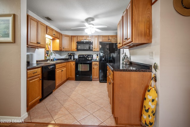 kitchen with black appliances, sink, ceiling fan, a textured ceiling, and light tile patterned flooring