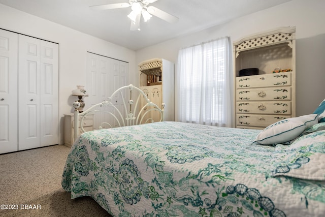 bedroom with multiple closets, ceiling fan, and carpet floors