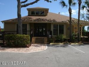 1401 S Palmetto Ave Unit 811, Daytona Beach, FL 32114 - view of property featuring uncovered parking and fence