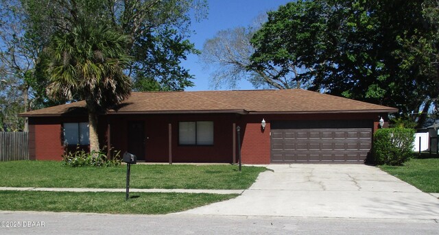 ranch-style house with a garage and a front yard