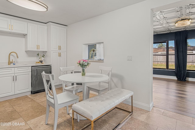 dining space with an ornate ceiling and baseboards