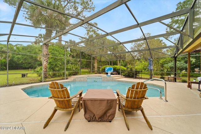 view of pool with glass enclosure, a jacuzzi, and a patio