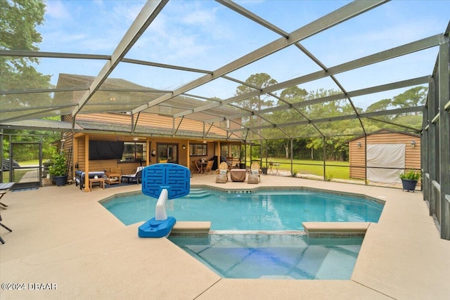 view of swimming pool featuring a lanai, an outdoor living space, and a patio area