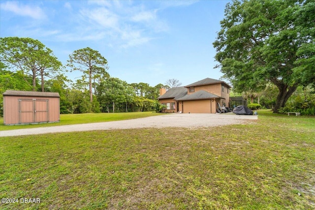 view of yard with a garage and a storage unit