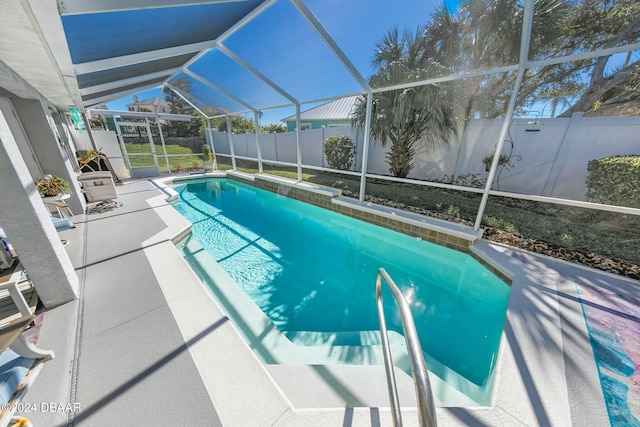 view of pool featuring a patio and glass enclosure