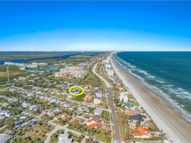 bird's eye view with a beach view and a water view