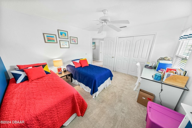 bedroom with carpet, a closet, and ceiling fan