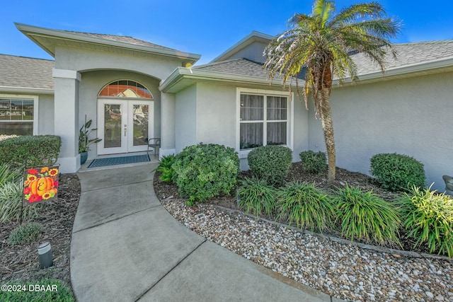 property entrance featuring french doors