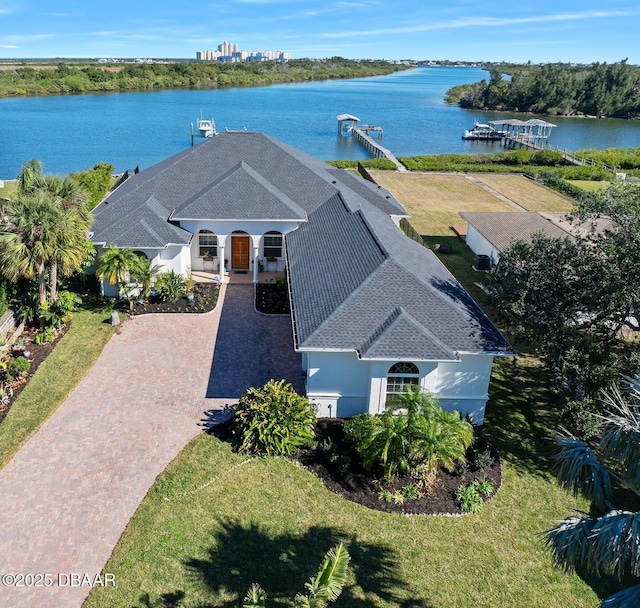 birds eye view of property with a water view