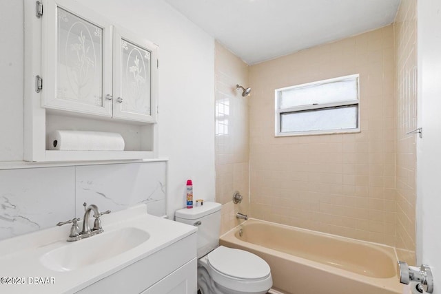 full bathroom with backsplash, vanity, toilet, and shower / bathing tub combination