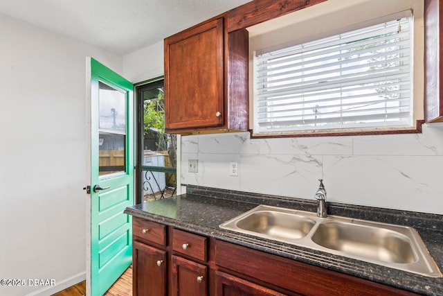 kitchen featuring a sink and backsplash