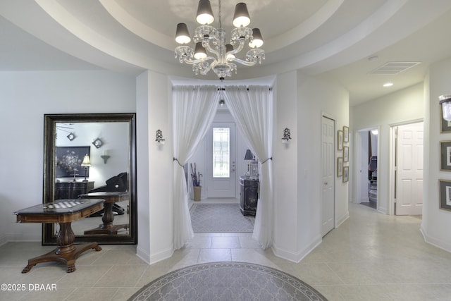 47 Abacus Ave, Ormond Beach, FL 32174 - hall with a chandelier, baseboards, and light tile patterned flooring