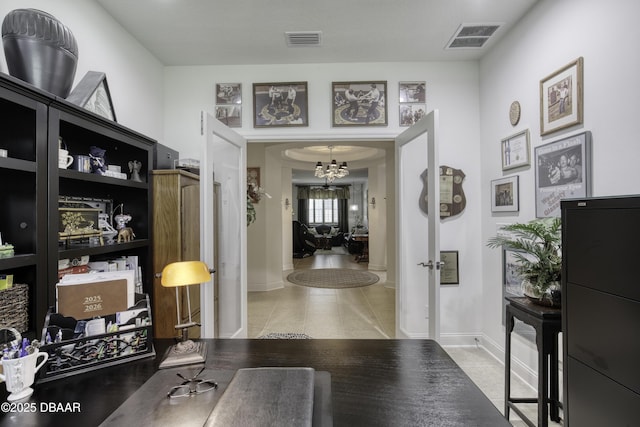 47 Abacus Ave, Ormond Beach, FL 32174 - hallway featuring a chandelier, tile patterned flooring, baseboards, and french doors