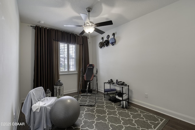 47 Abacus Ave, Ormond Beach, FL 32174 - workout room with a ceiling fan, baseboards, and wood finished floors