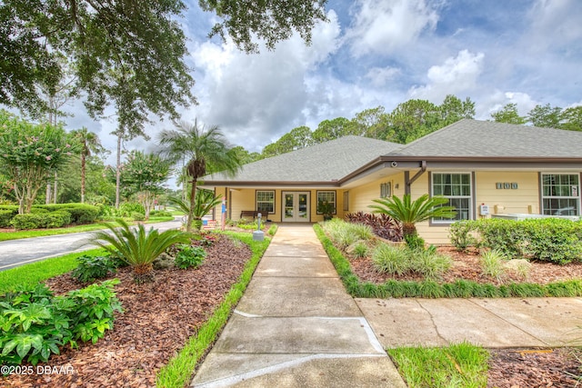 47 Abacus Ave, Ormond Beach, FL 32174 - view of front of house featuring french doors and roof with shingles